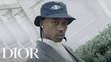 Travis Scott models the Air Dior line